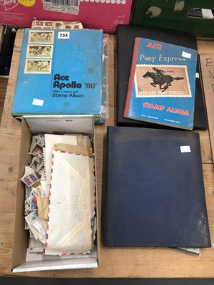 Lot 734 - Four stamp albums together with loose stamps