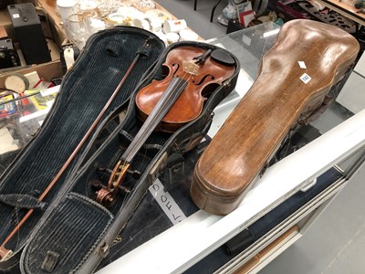 Lot 742 - A violin, a canvas covered and a wooden violin...