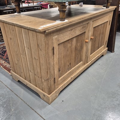 Lot 108 - A large pine kitchen island with four opposing...