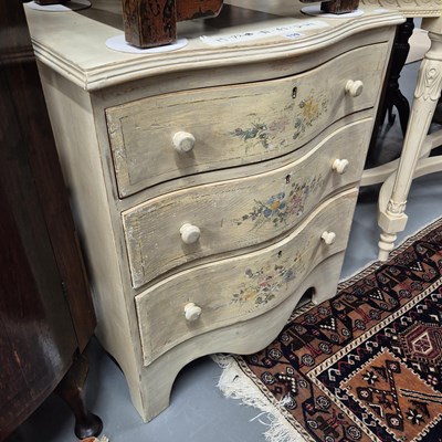 Lot 119 - A painted three drawer serpentine front chest...