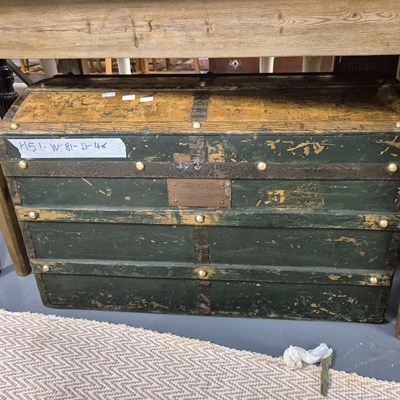 Lot 130 - A vintage dome top cabin trunk and an oak iron-...