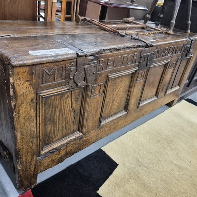 Lot 132 - An early oak panel front coffer, the front...