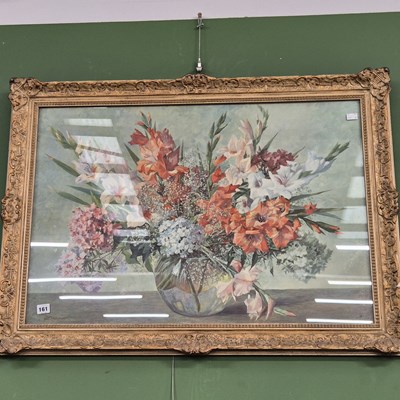 Lot 161 - A large gilt-framed still life print of flowers.