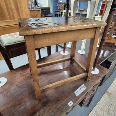 Lot 184 - A carved hardwood stool