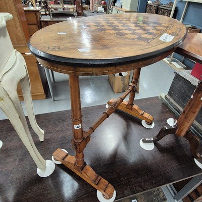 Lot 188 - A Victorian walnut side table with chequer...