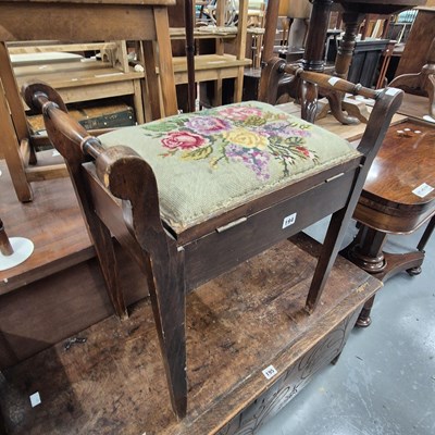 Lot 194 - A piano stool
