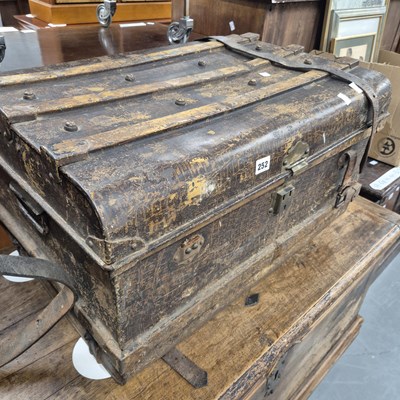 Lot 252 - A vintage tin trunk