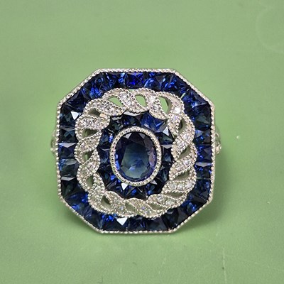 Lot 1066 - A platinum 950 square panel ring with...