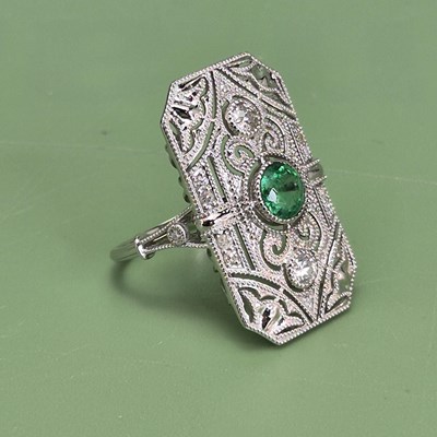 Lot 1072 - A large and ornate platinum 950 panel ring set...