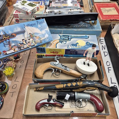 Lot 813 - Vintage boxed toy guns, a model boat etc.