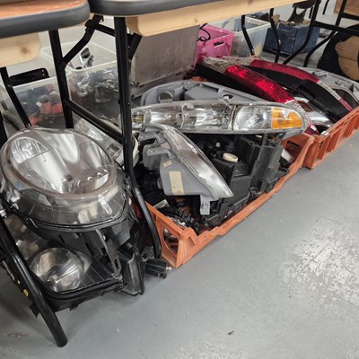 Lot 832 - Automobilia: a quantity of car headlamps etc.
