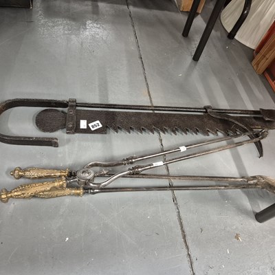Lot 852 - A set of fire irons and a chimney pot hanger