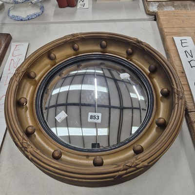 Lot 853 - An antique convex wall mirror