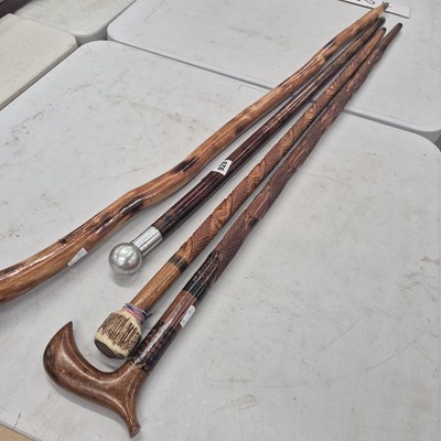 Lot 928 - Four walking sticks
