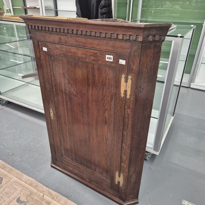 Lot 490 - A Georgian oak corner cabinet