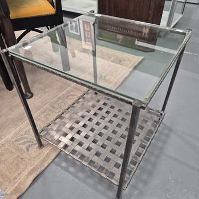 Lot 491 - A wrought iron and glass occasional table