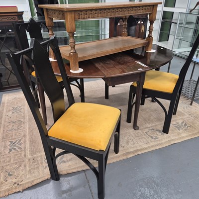 Lot 494 - A set of four ebonised Gothic-style side chairs