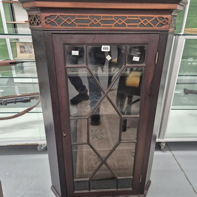 Lot 495 - A 19th-century mahogany corner cabinet with...