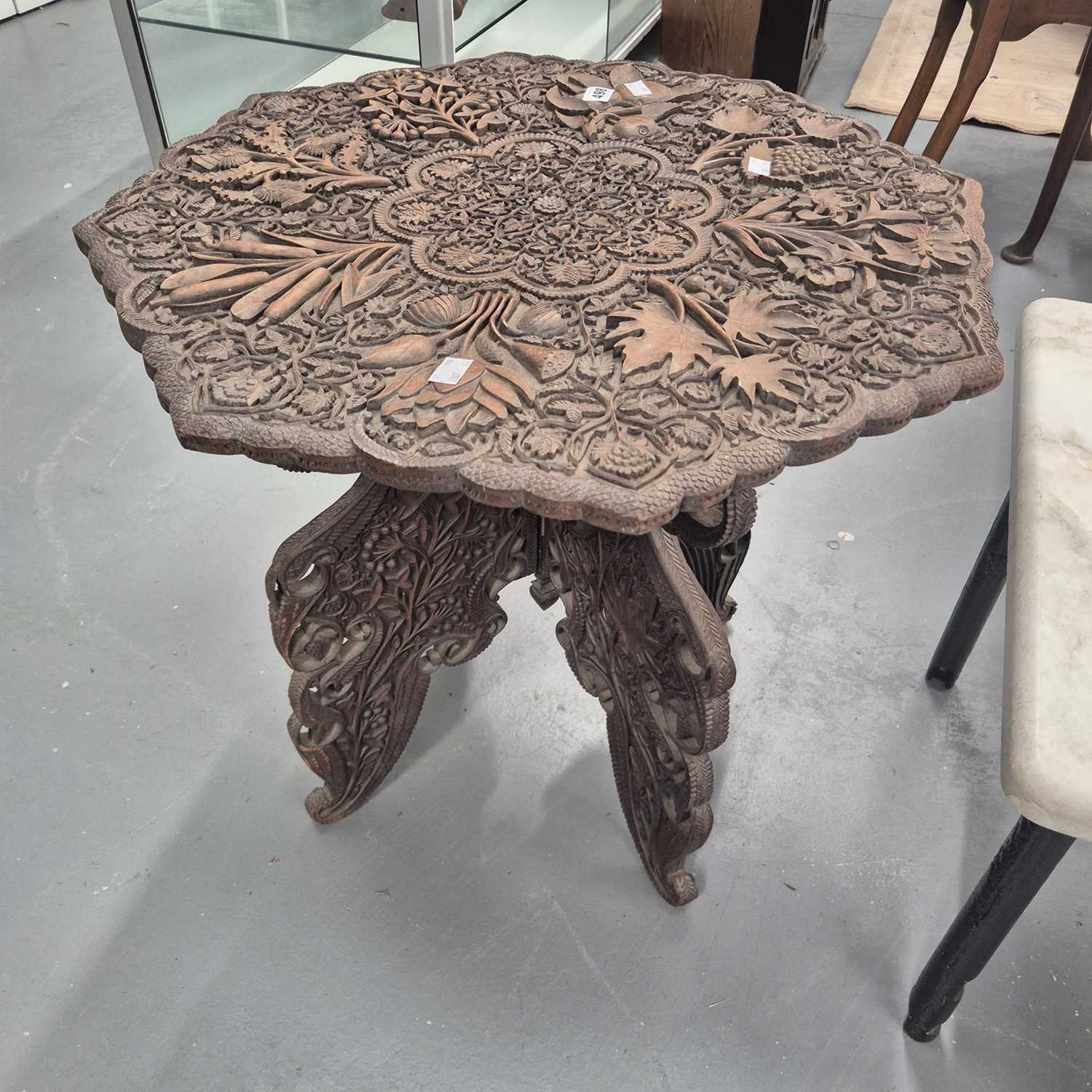 Lot 498 - An Arts and Crafts period carved eastern
