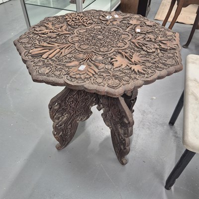 Lot 498 - An Arts and Crafts period carved eastern...