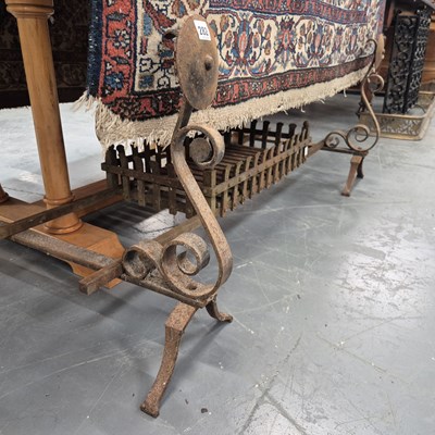 Lot 282 - A wrought iron large fire grate and dogs.