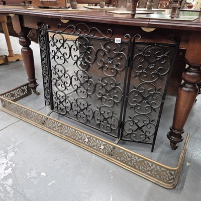 Lot 288 - A Victorian brass fender and a wrought iron...