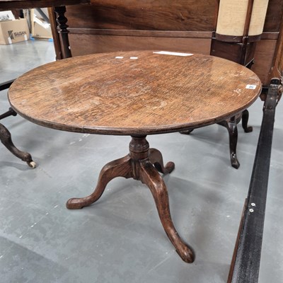 Lot 291 - A 19th century oak tripod table H 53cm Ø 73cm
