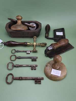 Lot 1126 - A brass pastry wheel with a wooden handle, a...