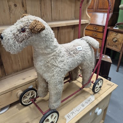 Lot 311 - A push along dog toy