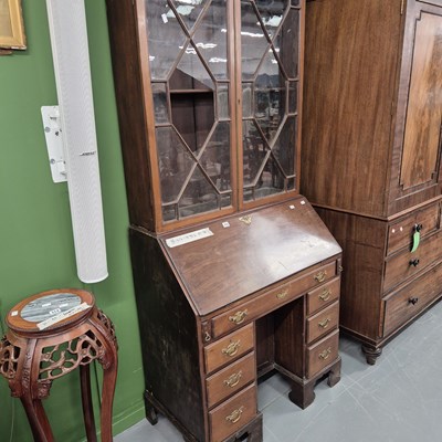 Lot 315 - A George III mahogany kneehole bureau with...