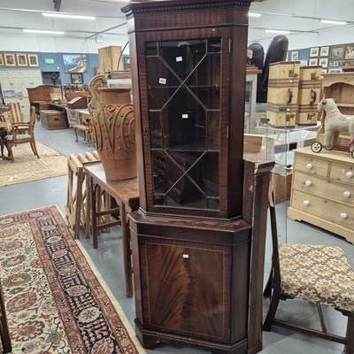 Lot 327 - A corner cabinet