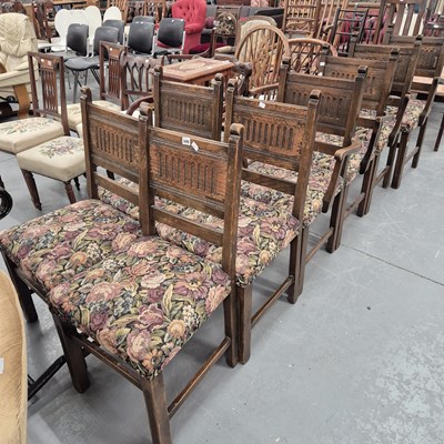 Lot 340 - A set of eight oak panel back dining chairs