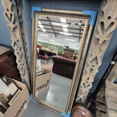 Lot 355 - A large wall mirror.