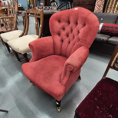 Lot 380 - A button back armchair