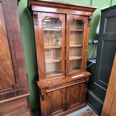 Lot 400 - A Victorian mahogany glazed bookcase on a...