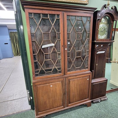Lot 435 - A Georgian mahogany glazed bookcase cabinet H...
