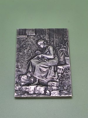 Lot 1154 - A silver rectangular tablet depicting in...