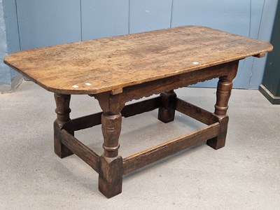 Lot 1174 - A 19th century oak table, the rounded...