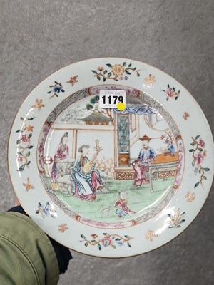 Lot 1179 - A pair of Chinese famille rose plates painted...