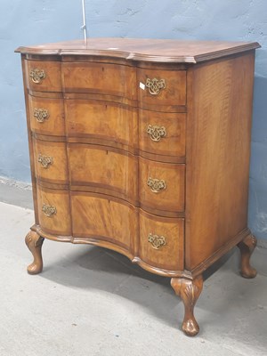 Lot 1188 - A 20th century walnut chest of four inverted...