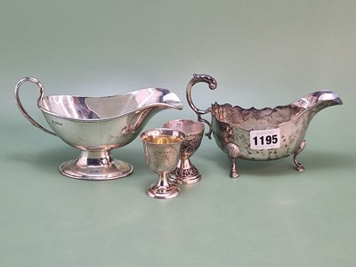 Lot 1195 - Two hallmarked silver sauce boats and two egg...