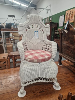 Lot 399 - An early 20th-century white wicker armchair