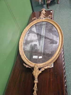 Lot 449A - A gilt framed oval mirror with floral...