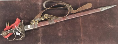 Lot 1006 - A sword, leather scabbard and belt, the black...