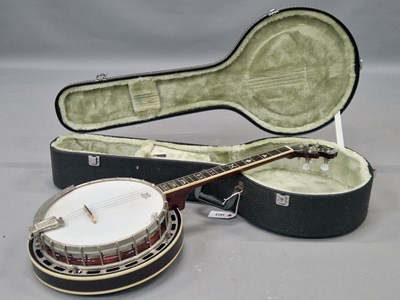 Lot 1013 - A cased Asbury four string banjo