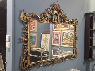 Lot 1026 - A 19th century rectangular mirror in a gilt,...