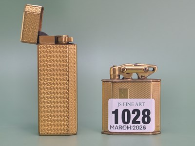 Lot 1028 - A Cohen and Charles 9ct gold petrol cigarette...