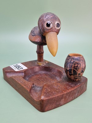 Lot 1053 - A Dunhill wood and nut ashtray modelled with a...