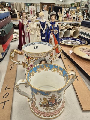 Lot 524 - Two figurines of Queen Elizabeth II, two of...