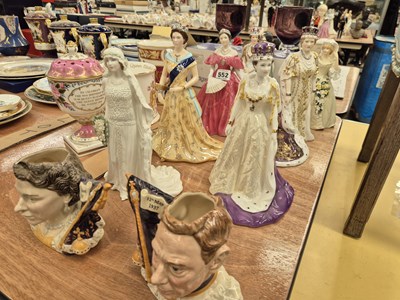 Lot 552 - Four Doulton and other figures of the Queen,...
